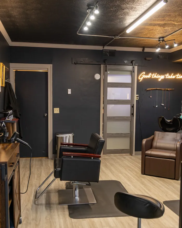 The salon interior — wash station and styling chair